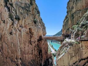 a bridge on the side of a mountain at Higuerón Hotel Curio Collection by Hilton in Fuengirola