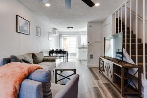 a living room with a couch and a flat screen tv at Modern Retreat near UofO, Autzen Stadium, Amazon Park #2 in Eugene