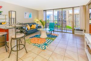 a living room with a couch and a table at Mountain View Condo Near Beach with Free Parking! in Honolulu