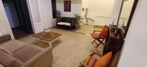 a living room with a couch and a table at Departamento 2 dormitorios Microcentro in Corrientes