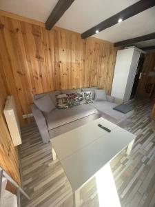 a living room with a couch and a table at estudio muy acogedor in Sierra Nevada