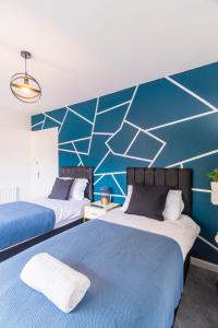 Säng eller sängar i ett rum på 2 Bedroom House By Maison Stays - Free Parking