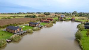 an aerial view of a house on a river at Lakeside Fishing Cabins in Boston