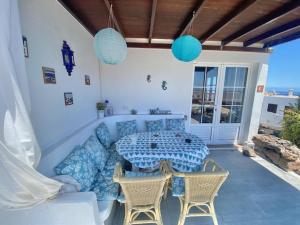 a patio with a table and chairs on a patio at Bungalow Rey Carlos in Puerto del Carmen