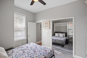 a bedroom with two beds and a ceiling fan at Lovely Renovated 1Bdrm 1Bath Getaway in Ocean City