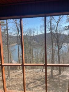 a view from a window of a view of a lake at Smokey Mountain Cabin in Murphy +3 photos