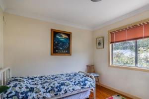Ένα ή περισσότερα κρεβάτια σε δωμάτιο στο Waterfront Delight on Cater