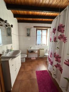 a bathroom with a sink and a toilet and a window at Kanala, estupendas vistas al Urdaibai in Canala +38 photos