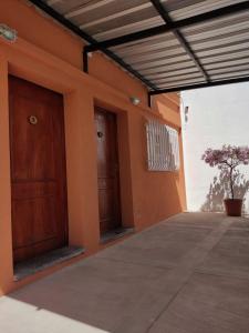 a building with two doors on the side of it at Ukiyo Apart in San Salvador de Jujuy