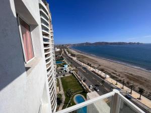a view of the beach from a balcony of a building at costa mansa 3200 in Coquimbo