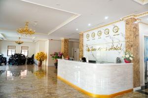 a lobby with a reception desk in a building at Khách sạn Time Lotus Hạ Long in Ha Long