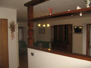 a living room with a large mirror in a room at Casa Danoli in Canale San Bovo