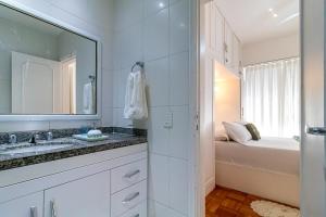 a bathroom with a sink and a mirror at Vinicius de Moraes Ipanema Apartment in Rio de Janeiro