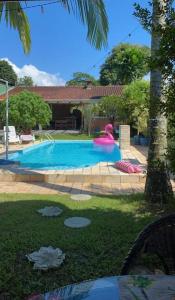 Swimmingpoolen hos eller tæt på Residencial Flamingo com Piscina em Morretes-PR