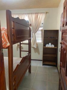 a bedroom with a bunk bed and a window at BAÑOS MINI DEPARTAMENTO AMOBLADO EN PLENO CENTRO de LA CIUDAD in Baños