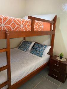 a couple of bunk beds in a room at BAÑOS MINI DEPARTAMENTO AMOBLADO EN PLENO CENTRO de LA CIUDAD in Baños