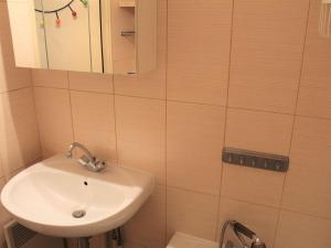 a bathroom with a sink and a mirror at Studio cosy avec balcon, 4 couchages à Vars, proche pistes et commerces - FR-1-330B-211 in Vars