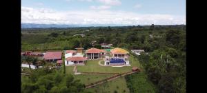 an aerial view of a large house in a forest at Finca La Perla in Armenia