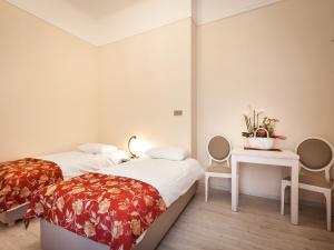 Posteľ alebo postele v izbe v ubytovaní Apartamenty Bonerowska 5