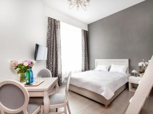 Posteľ alebo postele v izbe v ubytovaní Apartamenty Bonerowska 5