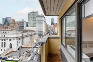 a balcony with a view of a city at Eden, dream high-end home in NYC in New York