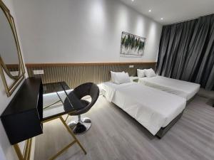 Letto o letti in una camera di One Point Hotel