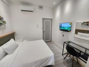 Letto o letti in una camera di One Point Hotel