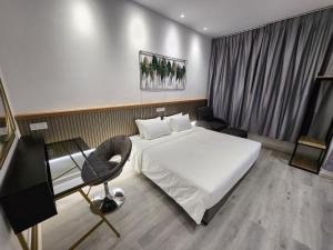 Letto o letti in una camera di One Point Hotel