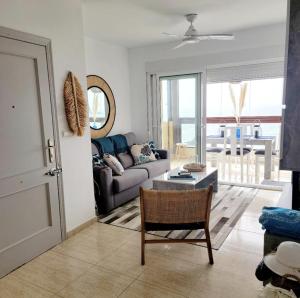 a living room with a couch and a table at Magnificent Mediterranean Views in Cabo de Palos