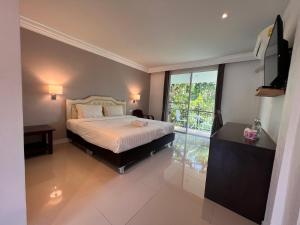 บ้านสวนสมบูรณ์客房内的一张或多张床位