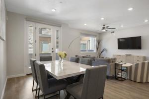 a dining room and living room with a table and chairs at Primo Lagoon Retreat condo in St. George