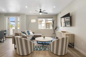 a living room with a couch and a table at Primo Lagoon Retreat condo in St. George