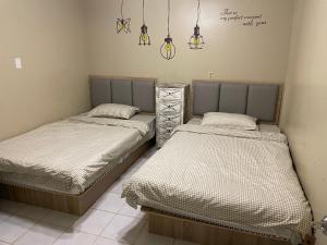 Een bed of bedden in een kamer bij DreamHouse