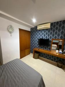 Postel nebo postele na pokoji v ubytování Bunny - Valentine Hotel - Bui Vien Street