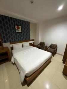 Postel nebo postele na pokoji v ubytování Bunny - Valentine Hotel - Bui Vien Street