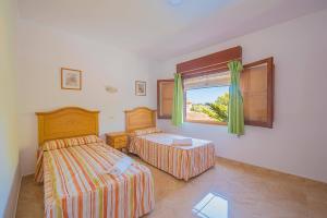 Posteľ alebo postele v izbe v ubytovaní Villa Bernia - PlusHolidays