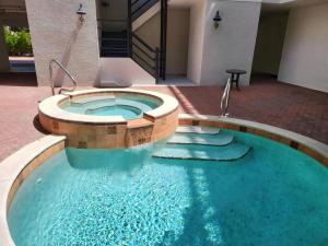 a swimming pool in the middle of a building at Vanderbilt Beach 3br/3ba condo in Naples