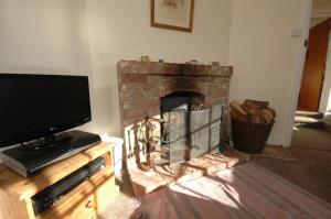 A television and/or entertainment center at Vane Cottage 