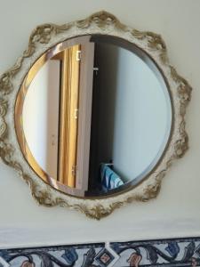 a mirror on a wall in a room at 19 Blue in Kingston Beach
