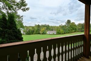 a view from the balcony of a house with a golf course at Unit 109 2 BDRM 2 BA condo in Birchwood