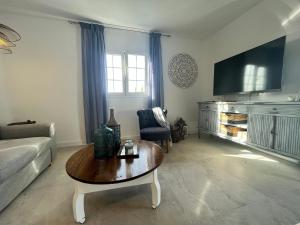 a living room with a couch and a coffee table at Barbican in Playa Honda