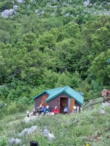 a group of people sitting outside of a smallshed at Livari Viewpoint in Livari