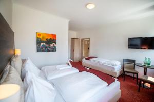 Krevet ili kreveti u jedinici u objektu Hotel Marc Aurel