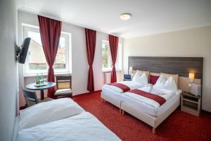 Krevet ili kreveti u jedinici u objektu Hotel Marc Aurel