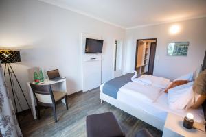 Televiisor ja/või meelelahutuskeskus majutusasutuses Hotel Marc Aurel