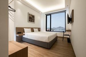 Katil atau katil-katil dalam bilik di Assa Hotel
