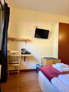 Postel nebo postele na pokoji v ubytování First Camp Moraparken Hotel
