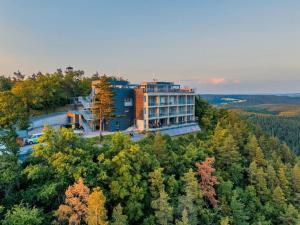 an aerial view of a building in the middle of a forest at Kulmberghaus Resort in Saalfeld