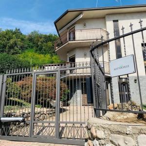 a building with a gate in front of it at Casavacanze Sottocolle in Valmorea