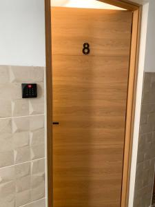 a door with a clock on top of it at Apartamentos La Ruta in Calpe